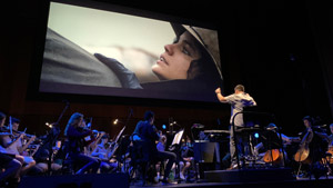 Orchestra and screen in rehearsal